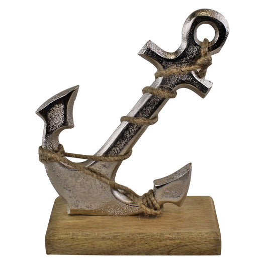 silver-metal-anchor-ornament-on-wooden-base